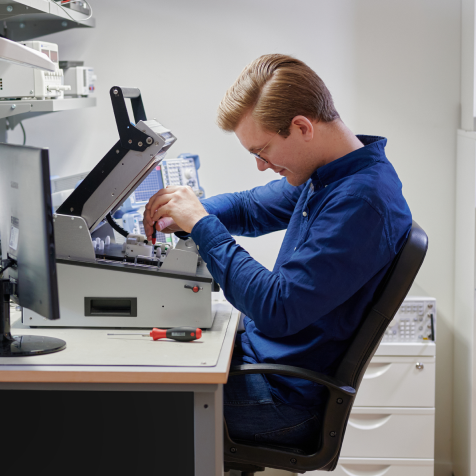 Mikrodust employee rigging the AtoMik test fixture